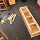 Those pieces of wood off to the left are what I used to secure the top after I measured it. those pieces aren’t perfectly straight, and neither was my top when I first turned it over...How about that?